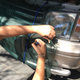 Jovan, measuring to make sure his netting would cover the many large grills on the front of his Land Cruiser Prado.